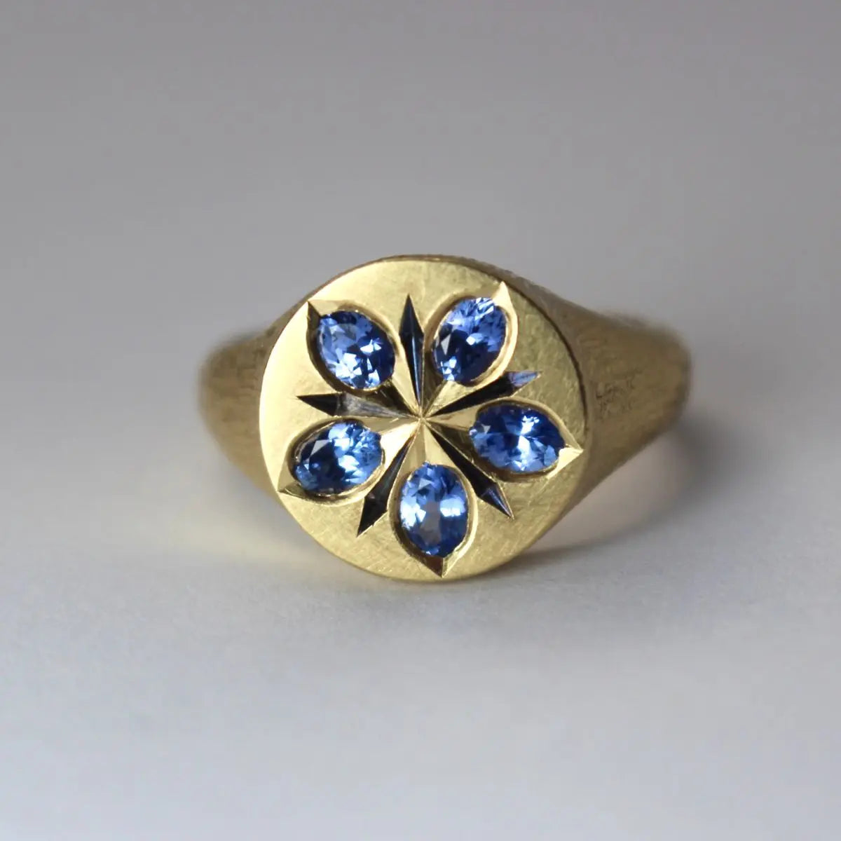 Ring with blue crystal flower in old gold color