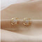 Cross earrings with floral spiral