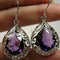 Silver earrings with purple crystal drops