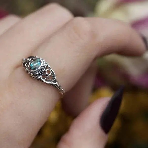 Filigree ring with rainbow shell