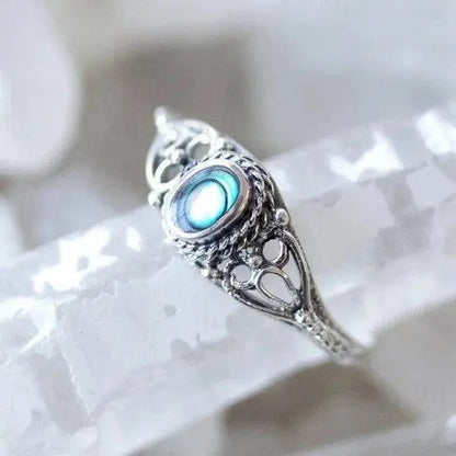 Filigree ring with rainbow shell