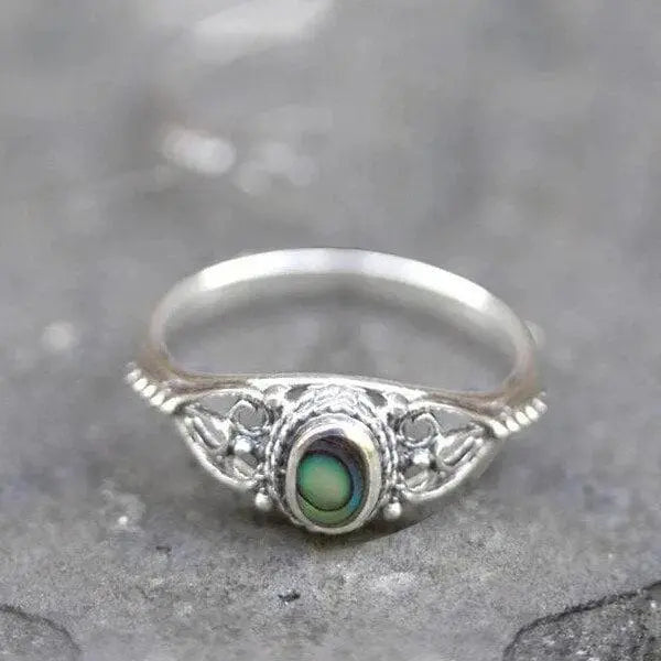 Filigree ring with rainbow shell
