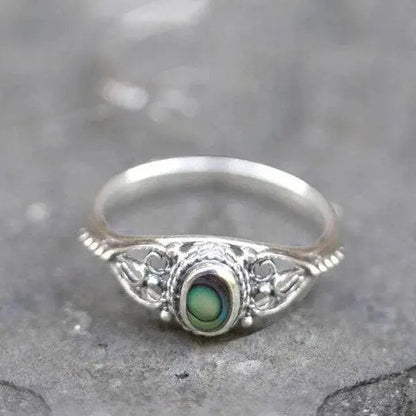 Filigree ring with rainbow shell