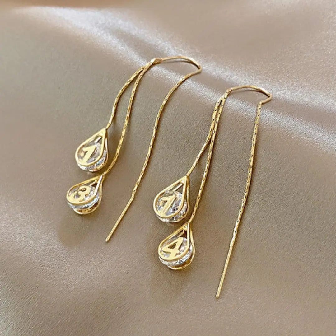 Gold earrings with numbers
