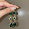 Luxury vintage earrings with green crystal