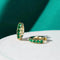 Gold earrings nuts with green zircons