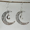 Silver earrings in the shape of the moon