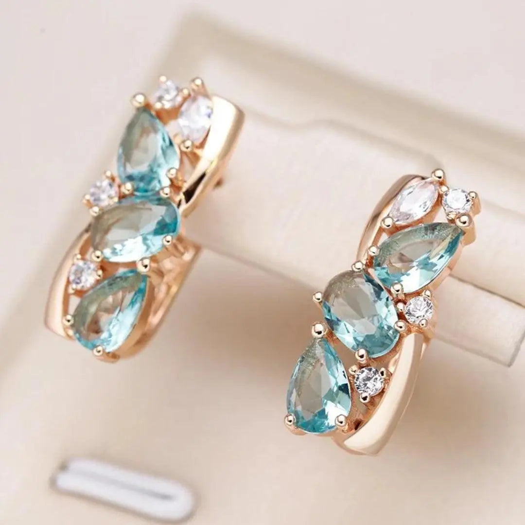 Gold earrings with blue zircons