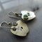 Earrings with green crystal in silver color