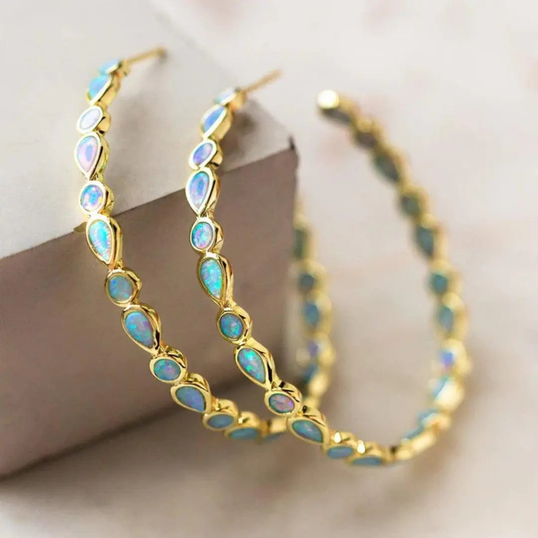 Gold earrings with blue opal in vintage style