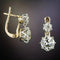 Gold earrings with zircons in vintage style