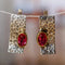 Gold and silver earrings with red zirconia in vintage style