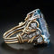 Gold ring with blue zirconia in vintage style
