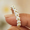 Adjustable sterling silver ring with hand-painted enamel daisy