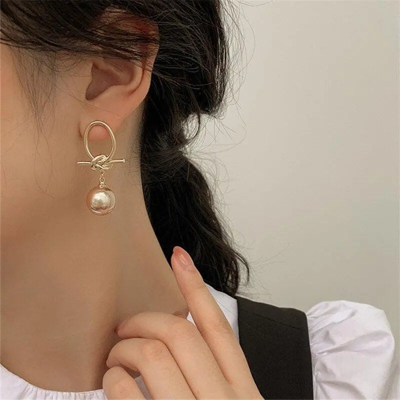 Gold hoop earrings with pearls