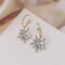Gold and silver star earrings