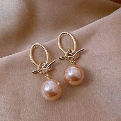 Gold hoop earrings with pearls