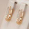 Elegant gold chain earrings with zircons
