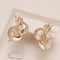 Elegant gold Guggenheim earrings