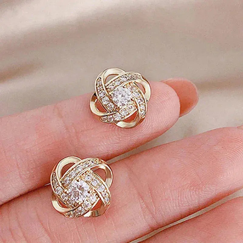 Cross earrings with floral spiral