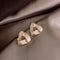 Modern geometric gold earrings with pearls