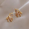 Gold unicorn earrings with zircons