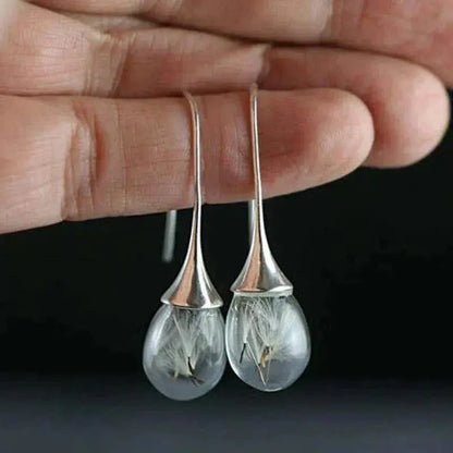 Silver earrings with dandelion pendant