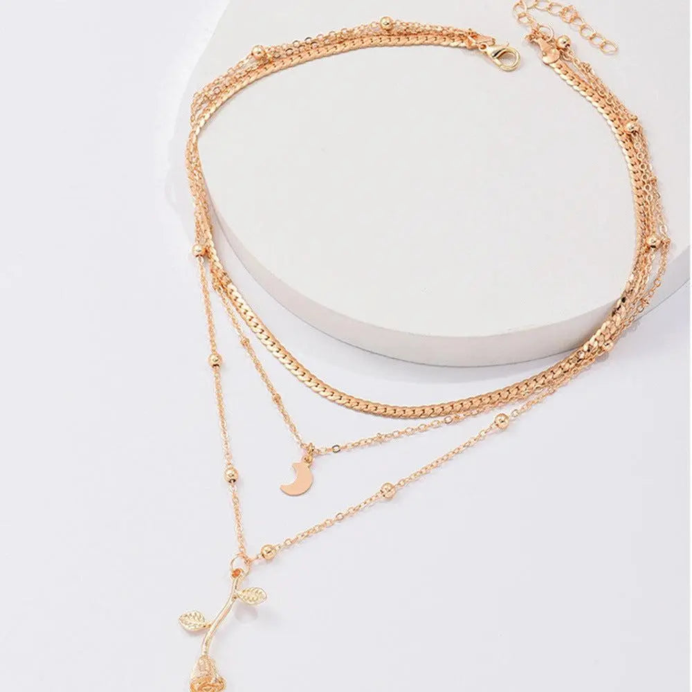 Gold necklace with rose