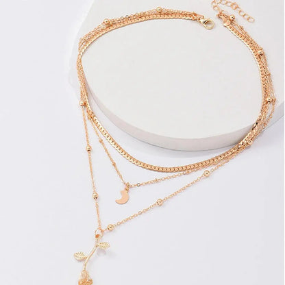 Gold necklace with rose