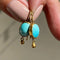 Gold earrings with blue stone