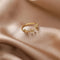 Adjustable ring with gold-colored crystal leaves