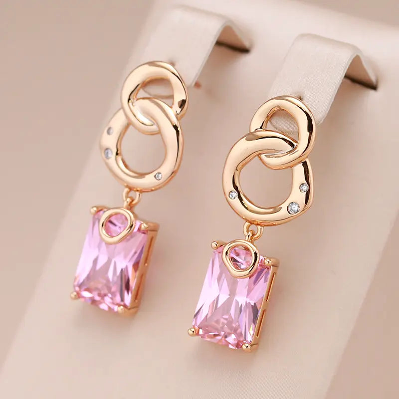 Small earrings with crystals in gold color
