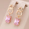 Small earrings with crystals in gold color