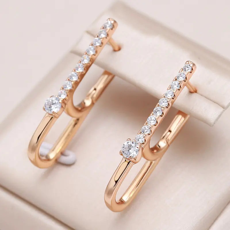 Gold luxury earrings with zircons