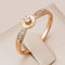 Ring with zircons in gold color