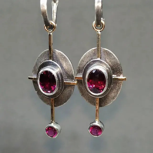 Boho earrings with garnet crystal in silver setting
