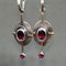 Boho earrings with garnet crystal in silver setting