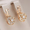 Elegant gold earrings with round zircons