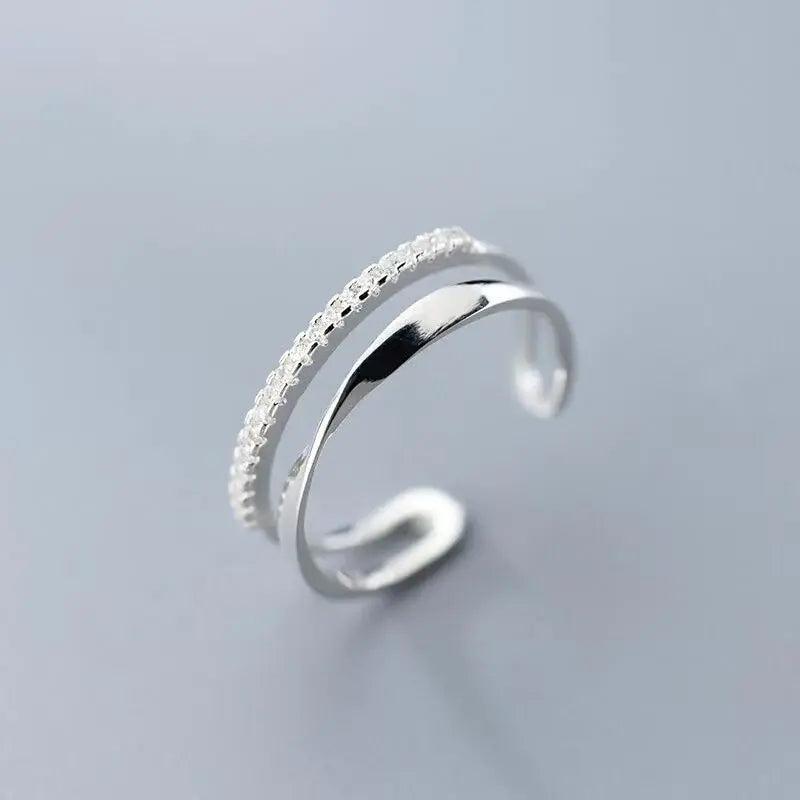 Adjustable silver ring with zircons