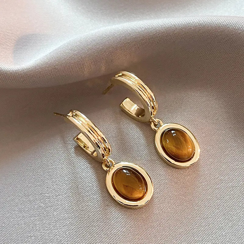 Gold earrings with orange crystals