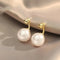 Gold earrings with pearls
