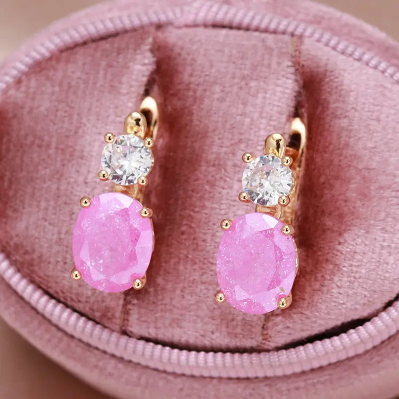 Elegant gold earrings with pink zircons