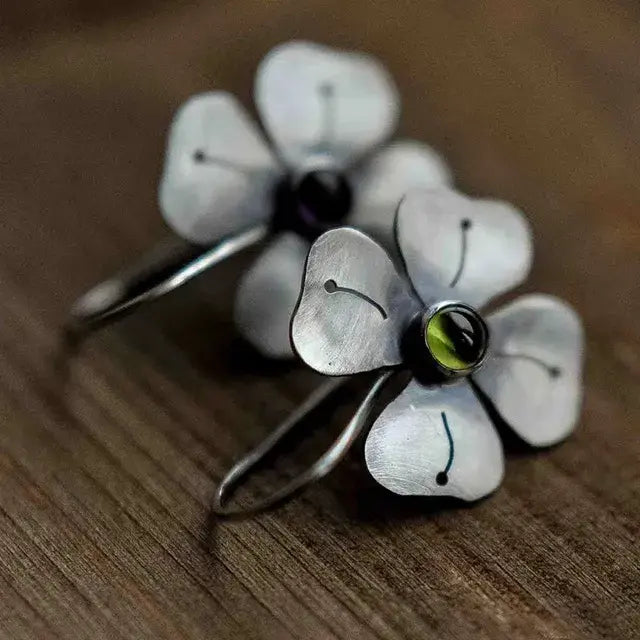 Vintage style earrings with green zircons