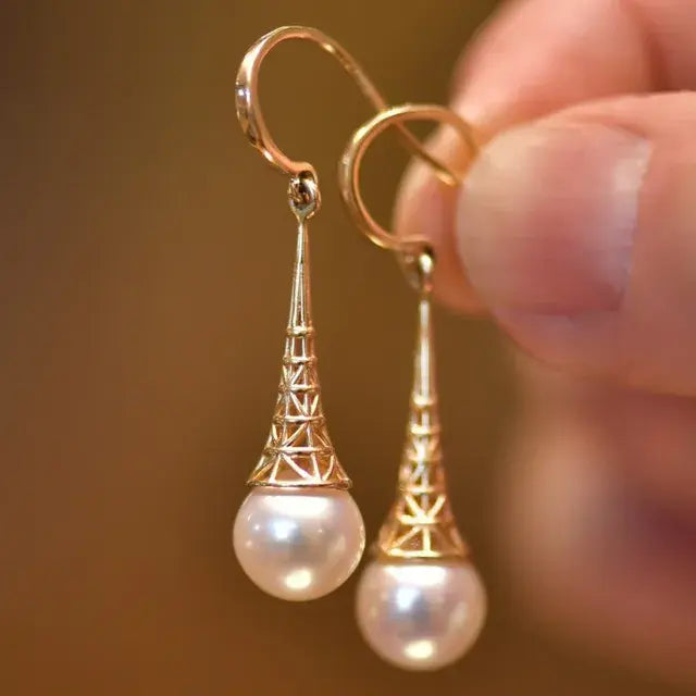 Gold earrings with pearls in vintage style