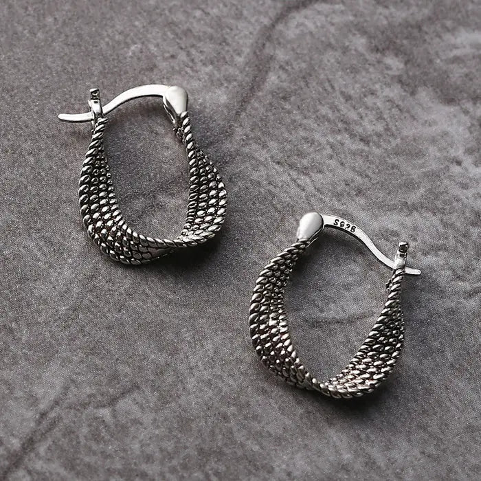 Irregular silver earrings in vintage style