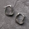Irregular silver earrings in vintage style