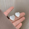 Elegant earrings with white hearts