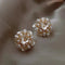Floral earrings with elegant pearls