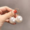 Elegant large earrings with pearls