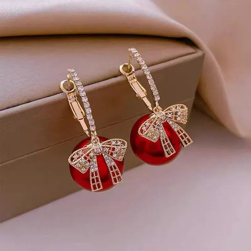 Elegant earrings with red pearls